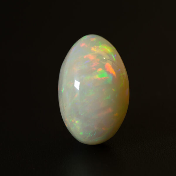 oval white opal 16.95ct with stripe patterns