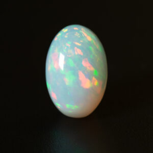 6.6ct oval white Ethiopian opal with floral rolling flash patterns