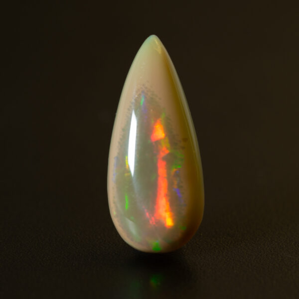 5.9ct pear-shape brown Ethiopian opal with a strong red fire